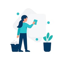 Cleaning wall cladding with sponge and soapy water